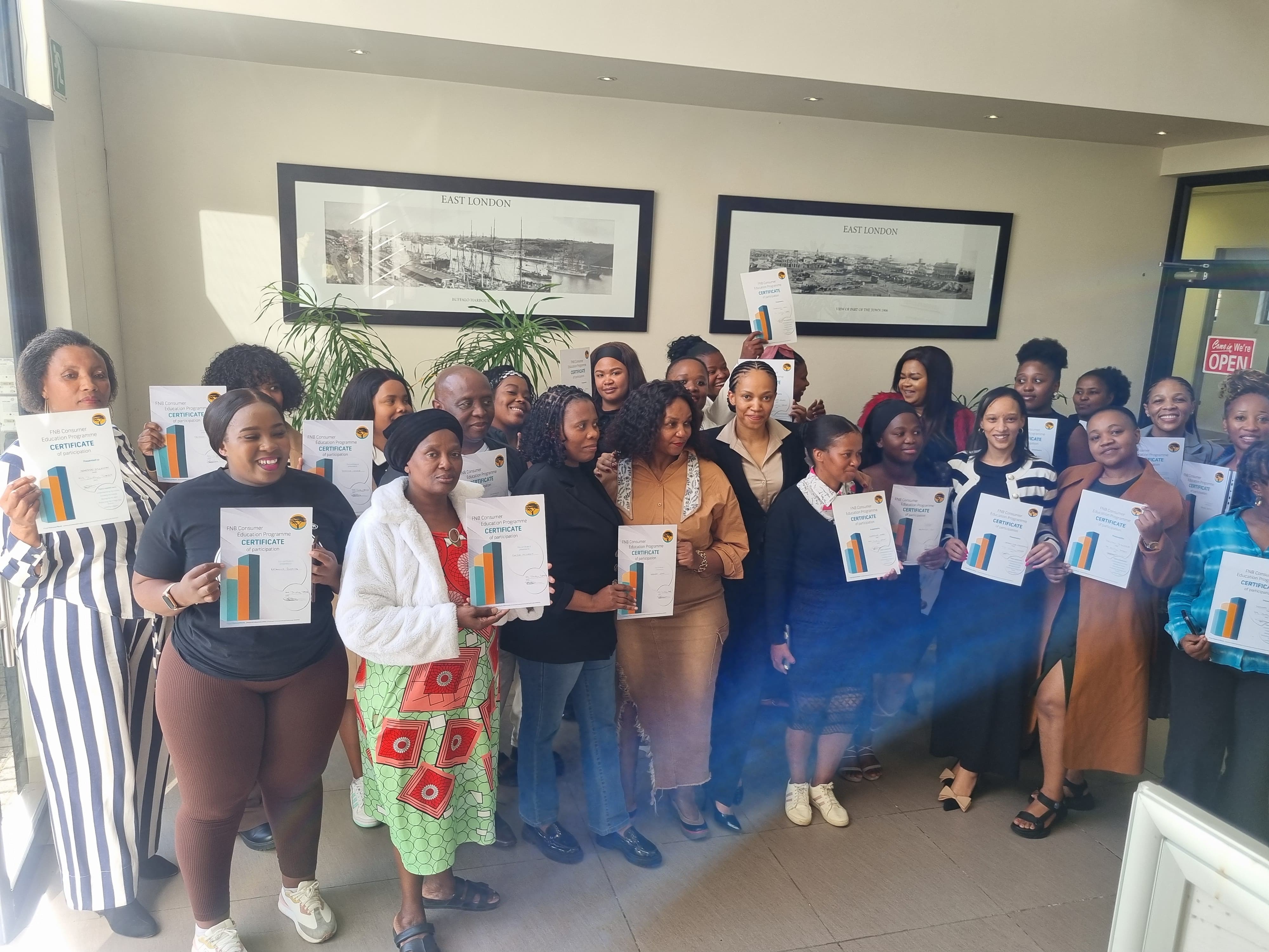 Successful graduates with their certificates