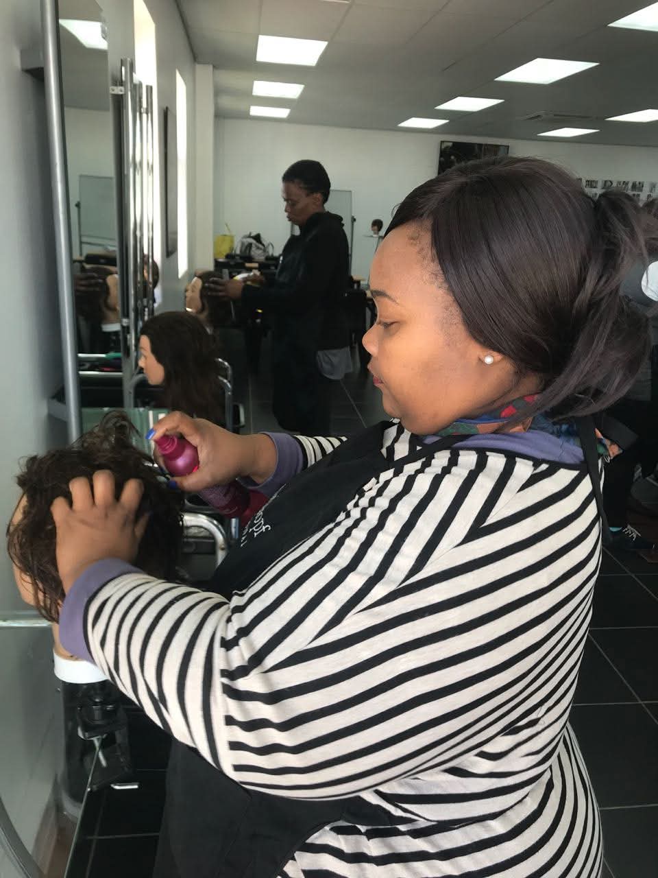 Student practicing advanced styling techniques